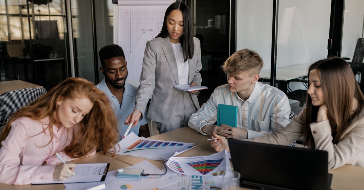 Small-business colleagues reviewing data controls on a laptop