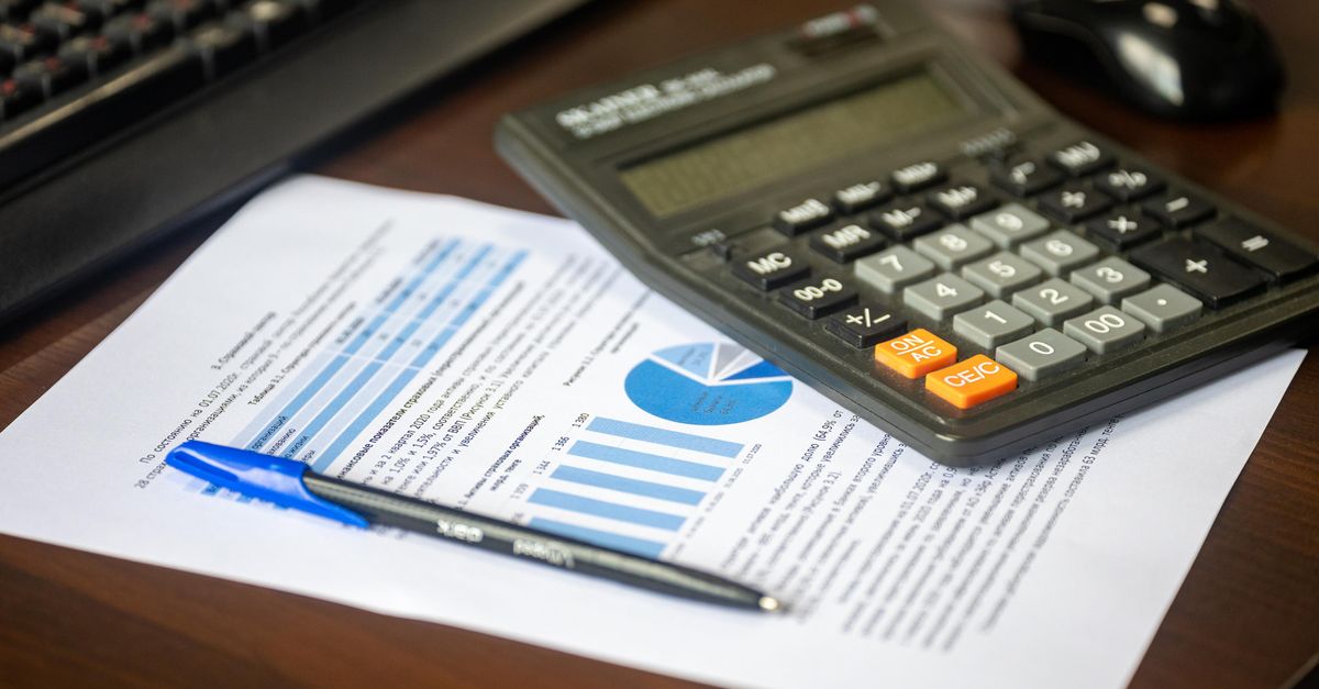 A calculator resting on printed financial statements